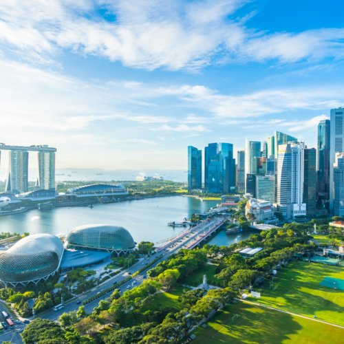 Beautiful architecture building exterior cityscape in Singapore city skyline with white cloud on blue sky